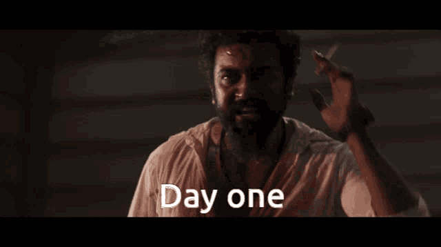 A film still captioned Day one.